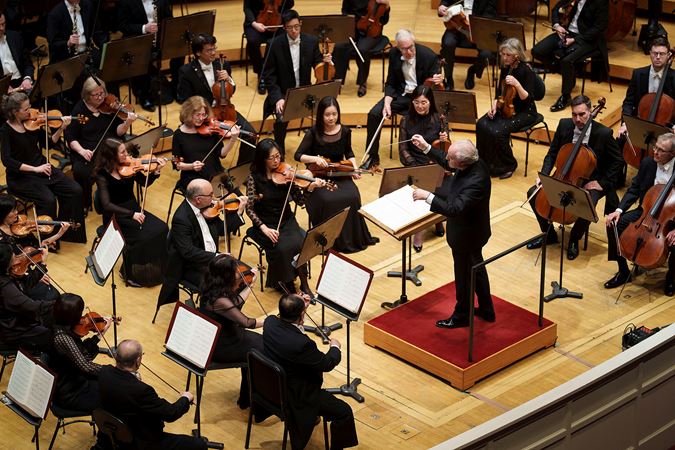 A photo of conductor Manfred Honeck leading the CSO