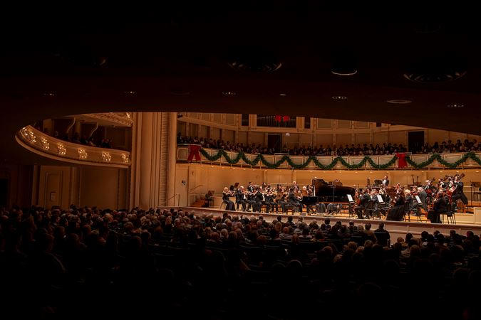 the audience watches raptly during the piano concerto