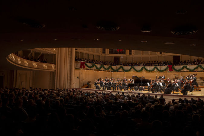 the audience watches raptly during the piano concerto