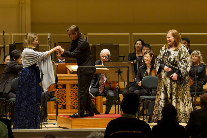 Daniela Candillari shakes hands with Giulia Semenzato on stage after the performance