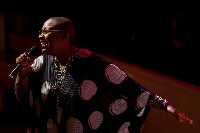 Cécile McLorin Salvant sings with her hand outstretched