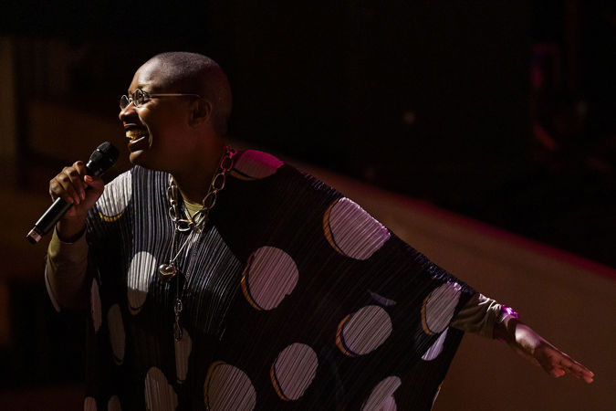Cécile McLorin Salvant sings with her hand outstretched