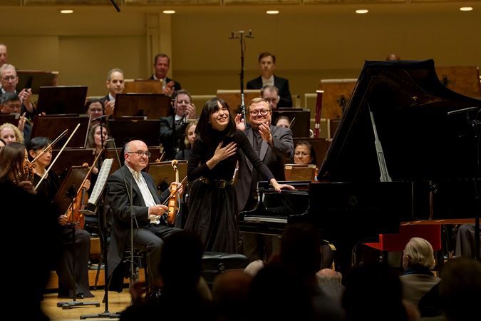 A bow shot of pianist Alice Sara Ott on stage