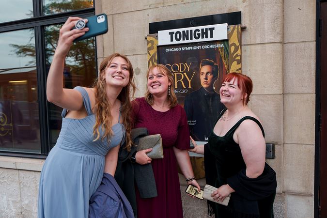 guests in front of poster