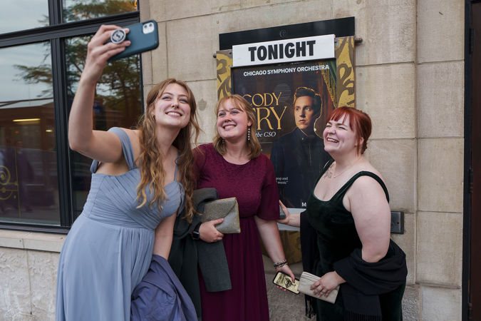 guests in front of poster