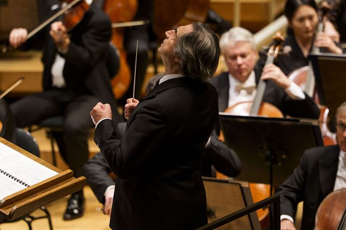 Riccardo Muti raises his fists as he gestures to the Orchestra