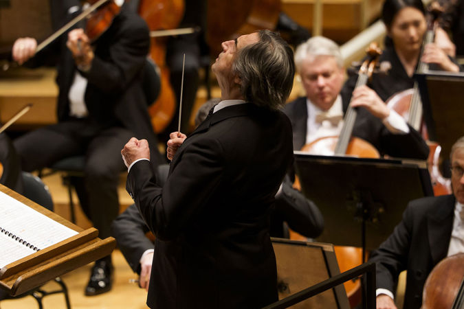 Riccardo Muti raises his fists as he gestures to the Orchestra