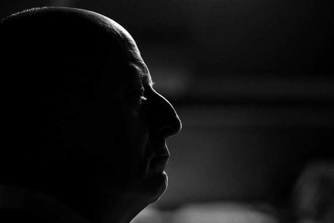 black and white close up: conductor Paavo Järvi gets serious backstage before the performance