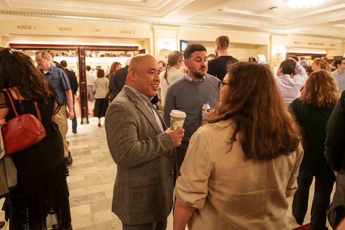Audience members in lobby