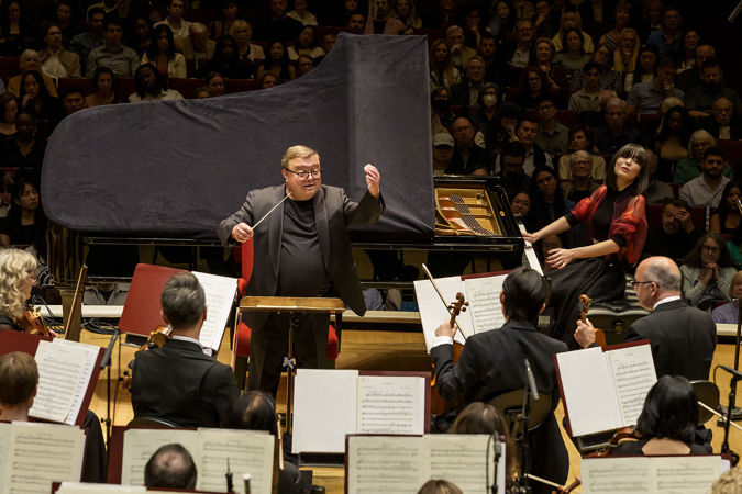 Action shot of pianist Alice Sara Ott and conductor Mikko Franck on stage