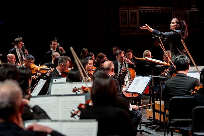 González-Granados cues the strings from the podium