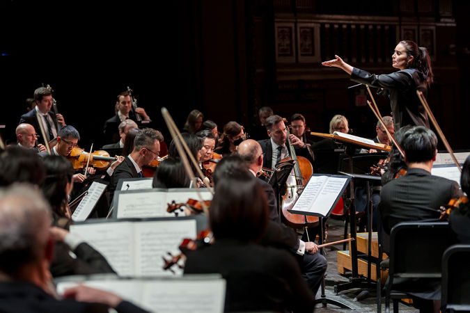 González-Granados cues the strings from the podium