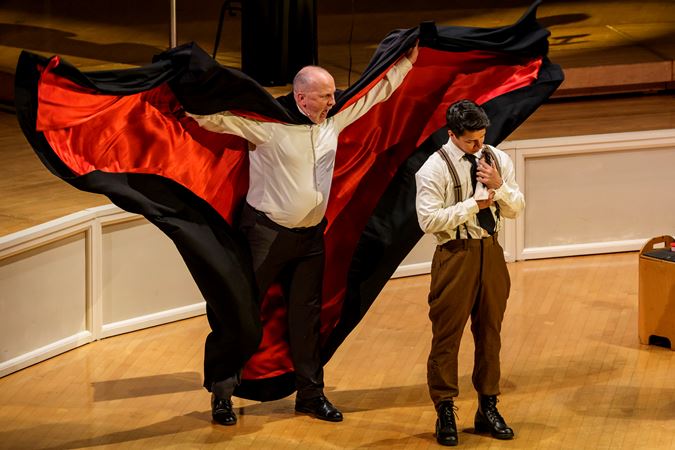Closeup of actors (the devil and the soldier) from The Goodman performing The Soldier's Tale with the Chicago Symphony Orchestra