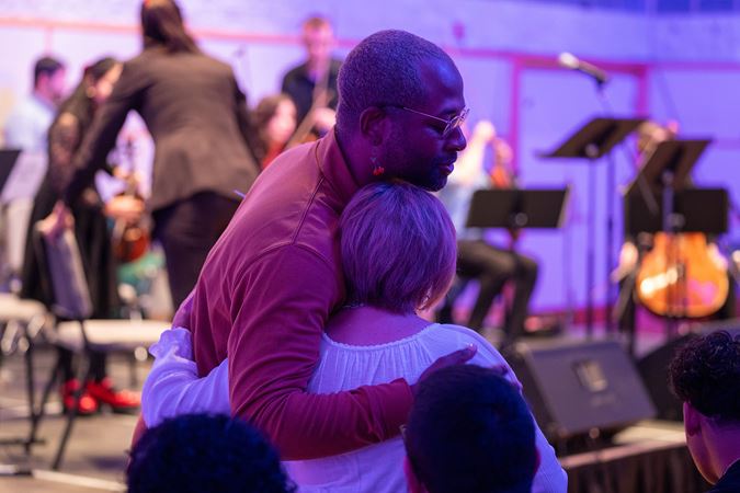 audience members hugging