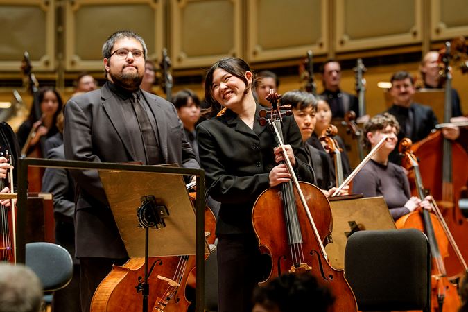 Closeup Of A Civic First Chair Cellist Bowing On Stage
