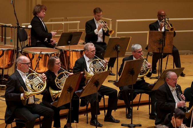 Group action shot of the CSO horn and percussion section