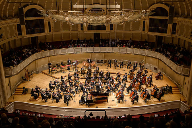 A wide shot of the CSO, conductor Santtu-Matias Rouvali and pianist Seong-Jin Cho