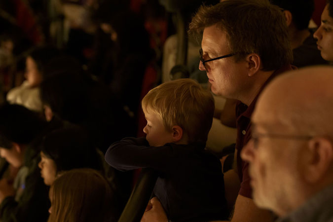 A little boy listens to the CSO from the Flynn Gallery