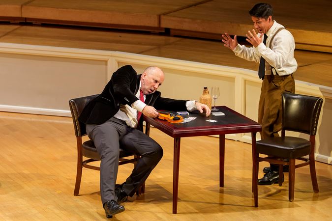 Closeup action shot of actors (the devil and soldier) from The Goodman presenting The Soldier's Tale