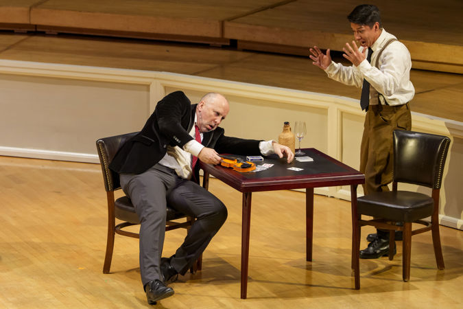 Closeup action shot of actors (the devil and soldier) from The Goodman presenting The Soldier's Tale
