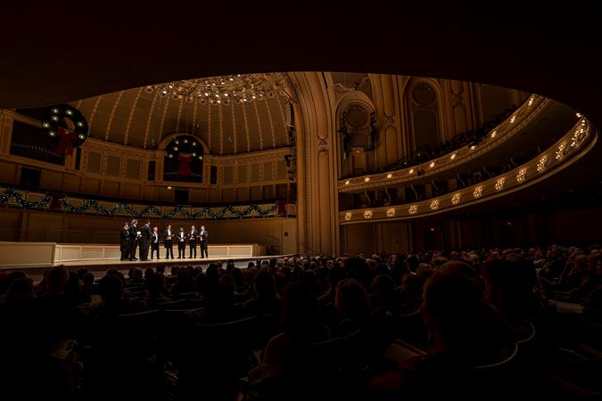 the audience on the main floor watches as Chanticleer sings