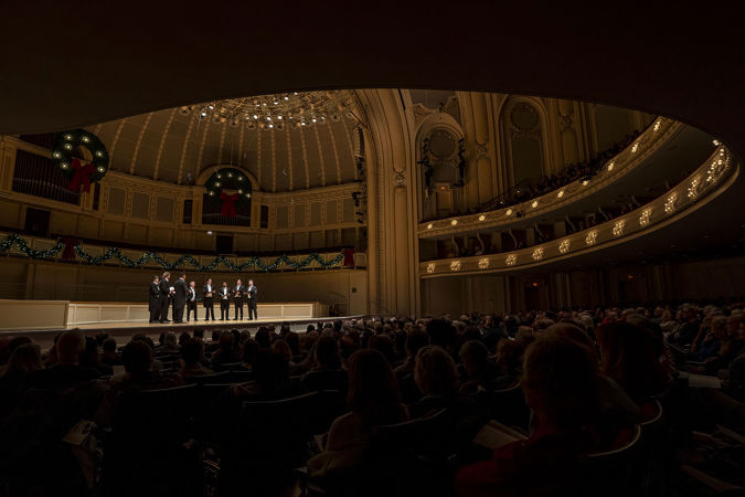 the audience on the main floor watches as Chanticleer sings