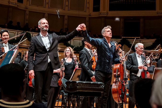conductor and cellist take a bow together