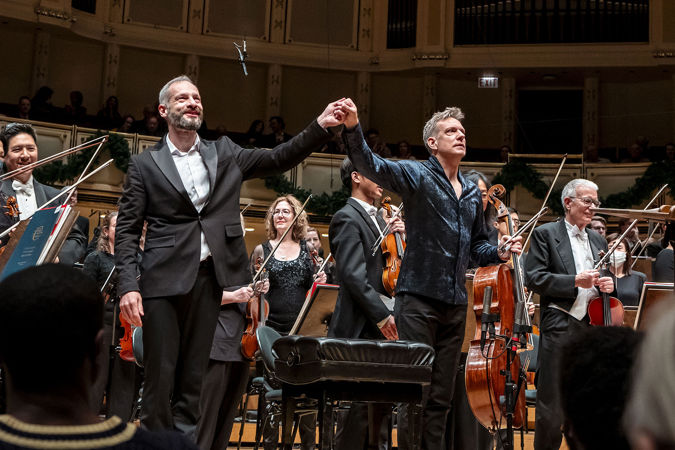 conductor and cellist take a bow together