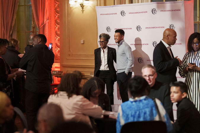 Violinist Randall Goosby taking photos with CSO African American Network members at a Meet-and-Greet postconcert event in Grainger Ballroom