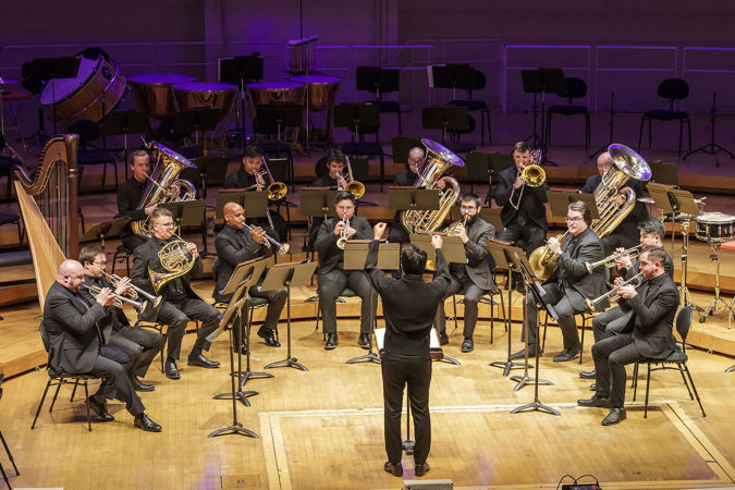 Conductor Jerry Hou leading musicians from the Civic Orchestra of Chicago and CSO