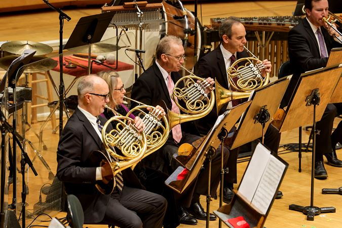 the CSO horn section performs