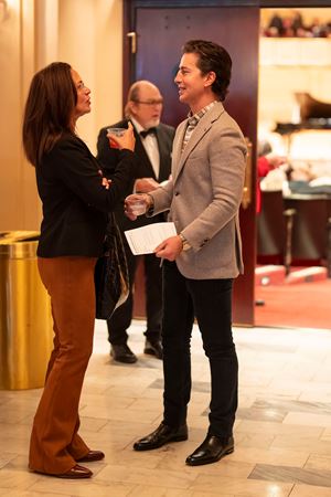 Two patrons talking in the Main Floor lobby