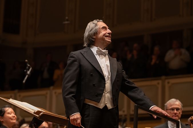 conductor smiling towards audience