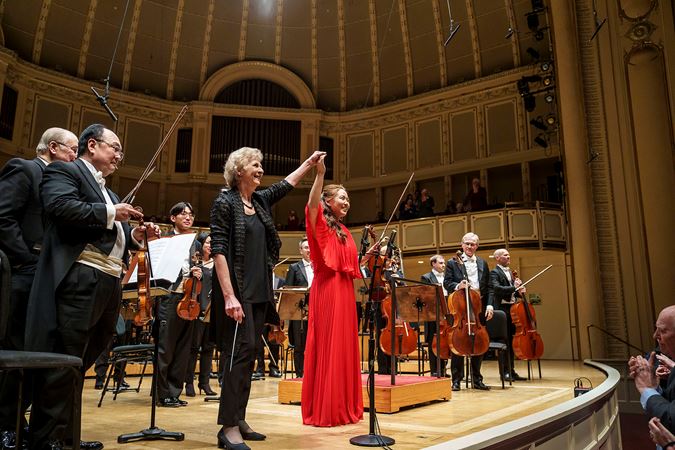 violinist Stella Chen and conductor Dame Jane Glover take a bow together