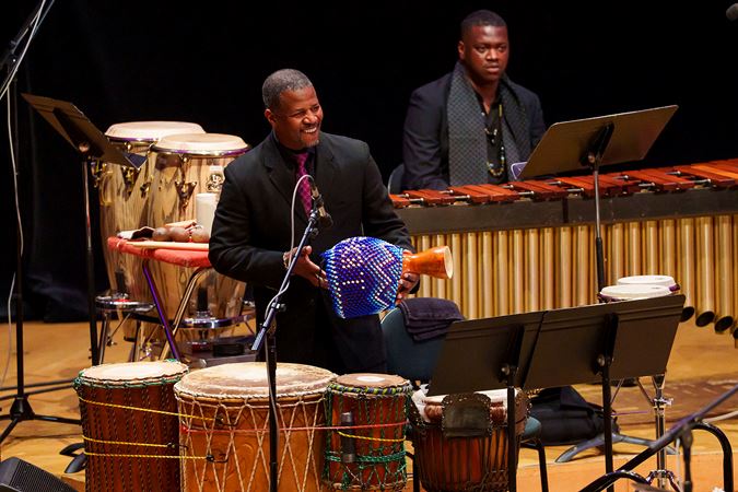 percussionists Xavier Breaker and Felix "D-Kat" Pollard perform on traditional African instruments