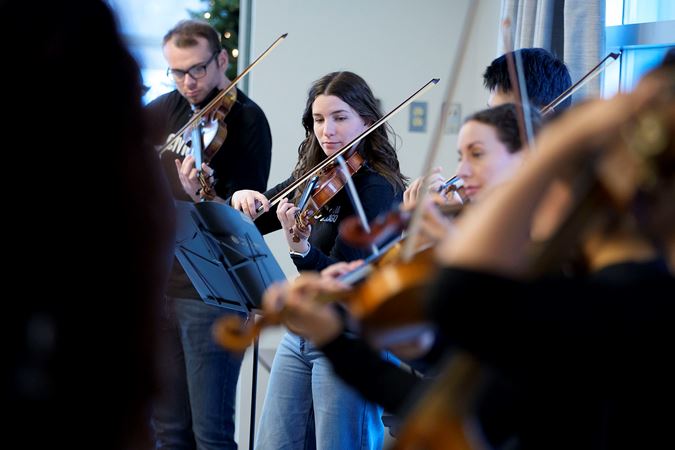 Closeup of Civic violin Lina Yamin performing during the 2025 Civic Bach Marathon