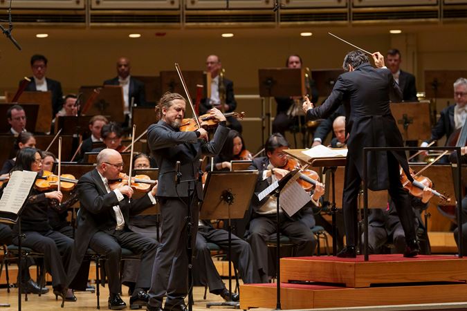 Christian Tetzlaff solos on violin as David Afkham directs the Orchestra