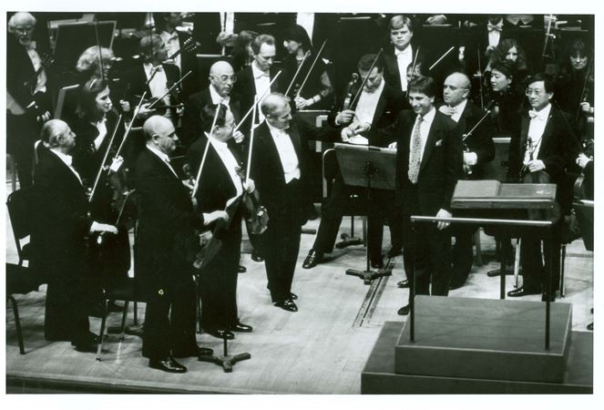 Daniel Barenboim and Corigliano receive applause following the world premiere of Symphony no. 1 on March 15, 1990