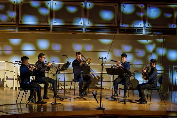 a brass quintet performs Adam Schoenberg's Reflecting Light, a poignant meditation on loss