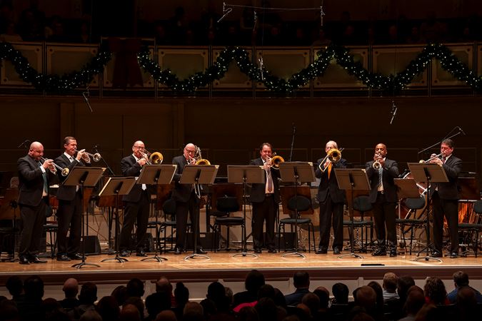a brass octet performs