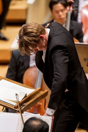 head bowed, Klaus Mäkelä gestures for the Orchestra to dig deep during the performance of Strauss' Ein Heldenleben