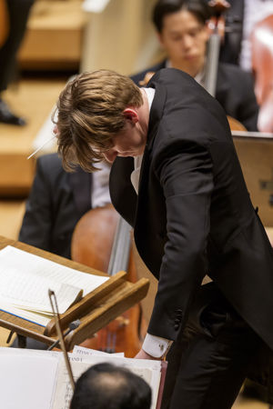 head bowed, Klaus Mäkelä gestures for the Orchestra to dig deep during the performance of Strauss' Ein Heldenleben