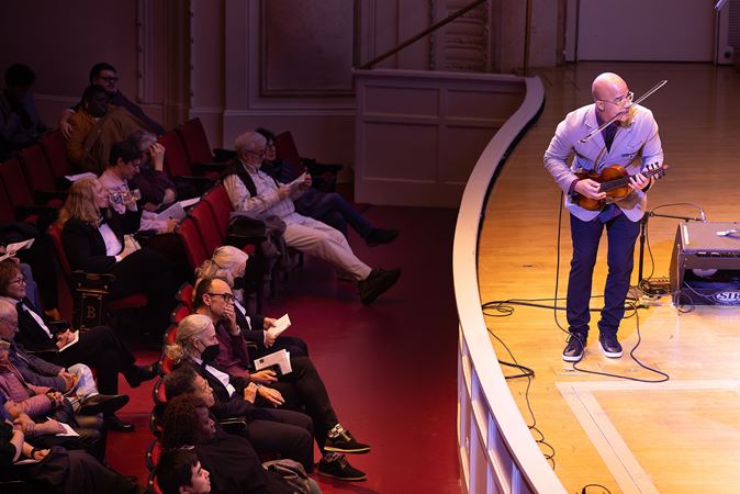 the audience watches as Daniel Bernard Roumain solos
