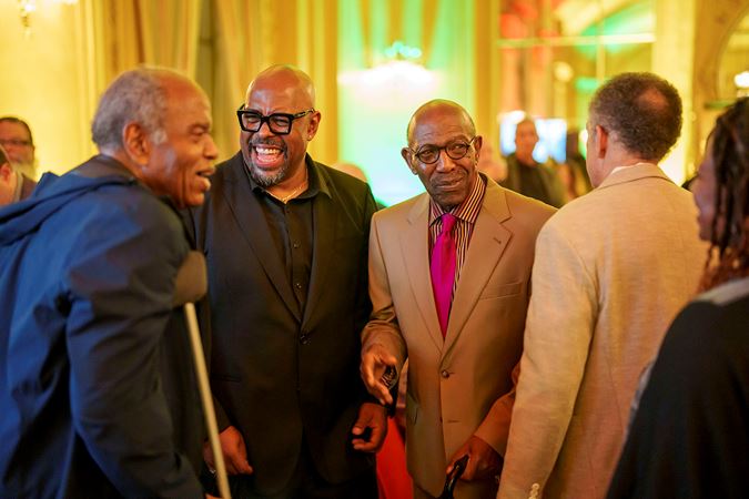 Christian McBride greets members of the CSO African American Network at the postconcert reception